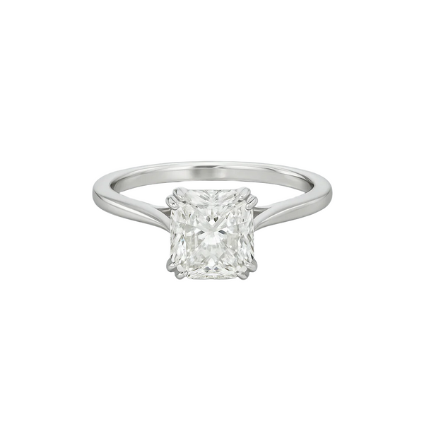 Diamond ring with a square-cut gemstone on a light gray background