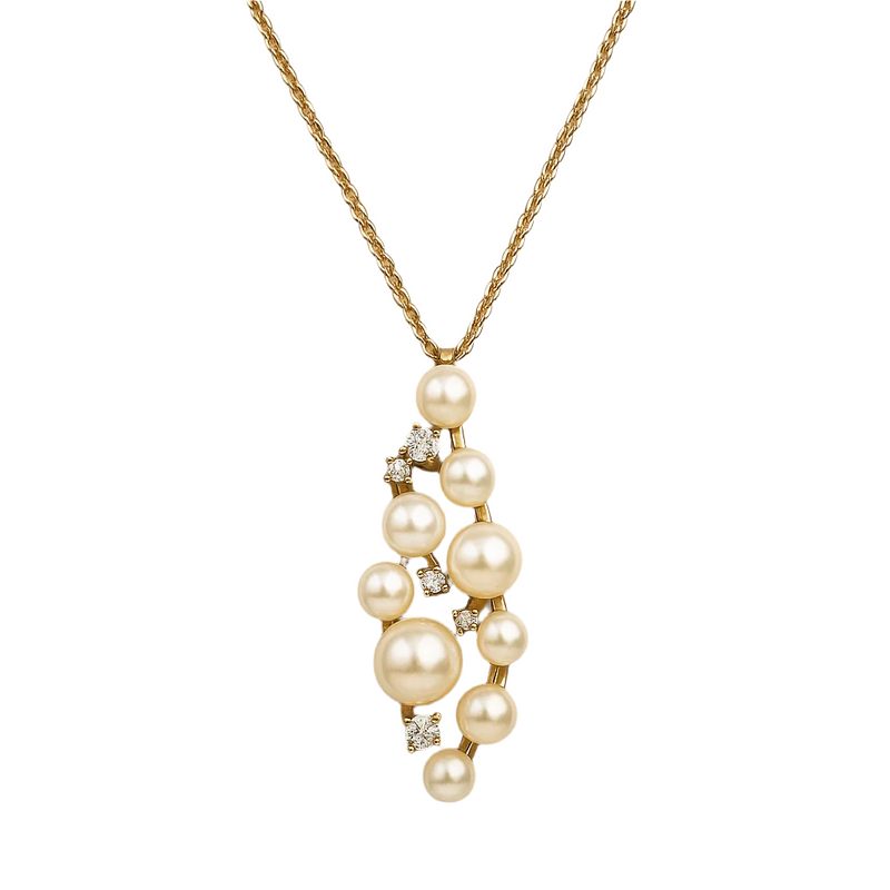 Pearl necklace with gold chain on a white background